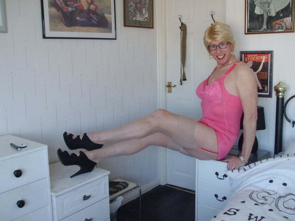 Miss Moorcock Loves To Expose Herself At Home In Her Pink Corselette
