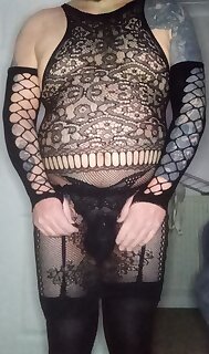 Slutty stretchy lacey dress & gloves. Sissy pouch g-string with garters & stockings & cage
