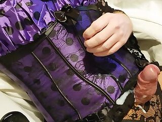 Crossdresser wanks and cums in purple corset