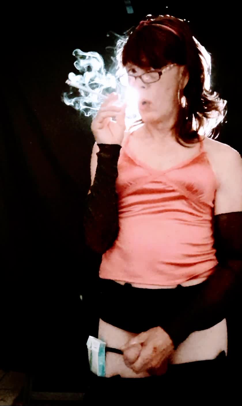 Sissy Posing While She Smokes And Strokes Pumping Her Pussy