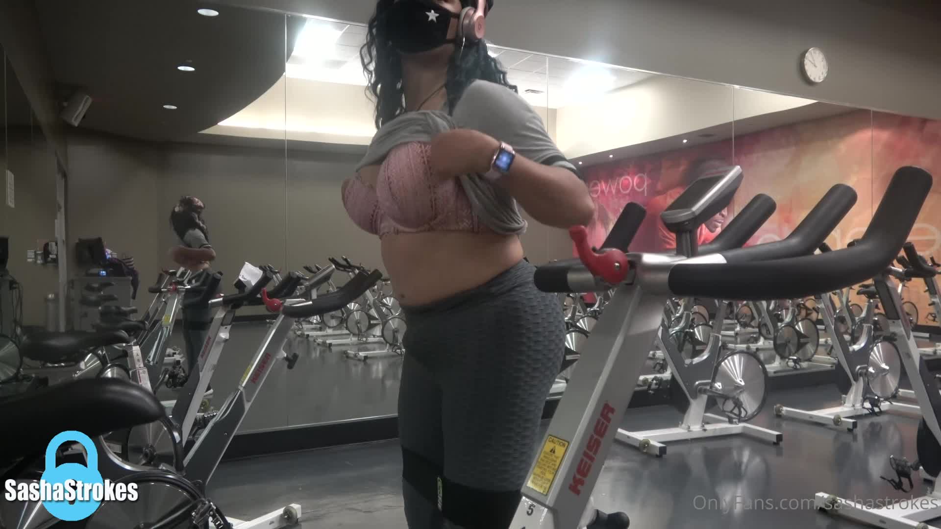 Stroking her big cock in the gym and shooting a cumshot